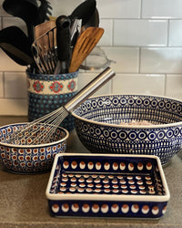 A picture of a Polish Pottery 8" Square Baker (Poppies & Posies) | P151S-IM02 as shown at PolishPotteryOutlet.com/products/8-square-baker-poppies-posies-p151s-im02