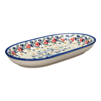 A picture of a Polish Pottery WR 7" x 11" Oval Roaster (Bows in Snow) | WR13B-WR15 as shown at PolishPotteryOutlet.com/products/7-x-11-oval-roaster-bows-in-snow-wr13b-wr15