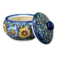 A picture of a Polish Pottery WR Round Covered Container (Bed of Blossoms) | WR31I-KG2 as shown at PolishPotteryOutlet.com/products/round-covered-container-bed-of-blossoms-wr31i-kg2
