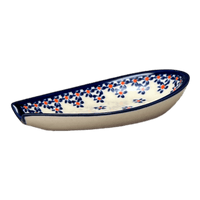 A picture of a Polish Pottery Zaklady 5" Spoon Rest (Falling Blue Daisies) | Y1015-A882A as shown at PolishPotteryOutlet.com/products/5-spoon-rest-falling-blue-daisies-y1015-a882a