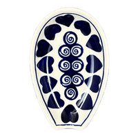 A picture of a Polish Pottery 5" Spoon Rest (Swirling Hearts) | Y1015-D467 as shown at PolishPotteryOutlet.com/products/5-spoon-rest-swirling-hearts-y1015-d467