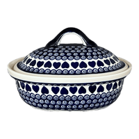 A picture of a Polish Pottery Zaklady 12.5" x 10" Large Covered Baker (Swirling Hearts) | Y1158-D467 as shown at PolishPotteryOutlet.com/products/12-5-x-10-large-covered-baker-swirling-hearts-y1158-d467