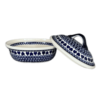A picture of a Polish Pottery Zaklady 12.5" x 10" Large Covered Baker (Swirling Hearts) | Y1158-D467 as shown at PolishPotteryOutlet.com/products/12-5-x-10-large-covered-baker-swirling-hearts-y1158-d467