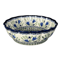 A picture of a Polish Pottery Zaklady Deep 9.5" Scalloped Bowl (Blue Tulips) | Y1279A-ART160 as shown at PolishPotteryOutlet.com/products/scalloped-9-5-bowl-blue-tulips-y1279a-art160
