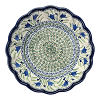 A picture of a Polish Pottery Zaklady Deep 9.5" Scalloped Bowl (Blue Tulips) | Y1279A-ART160 as shown at PolishPotteryOutlet.com/products/scalloped-9-5-bowl-blue-tulips-y1279a-art160