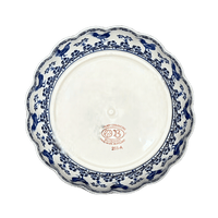 A picture of a Polish Pottery Zaklady Deep 9.5" Scalloped Bowl (Rooster Blues) | Y1279A-D1149 as shown at PolishPotteryOutlet.com/products/deep-9-5-scalloped-bowl-rooster-blues-y1279a-d1149