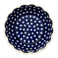 A picture of a Polish Pottery Zaklady Deep 9.5" Scalloped Bowl (Stars & Stripes) | Y1279A-D81 as shown at PolishPotteryOutlet.com/products/scalloped-9-5-bowl-stars-stripes-y1279a-d81