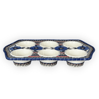 A picture of a Polish Pottery Zaklady Muffin Pan (Bloomin' Sky) | Y1778-ART148 as shown at PolishPotteryOutlet.com/products/muffin-pan-bloomin-sky-y1778-art148
