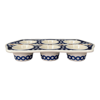 A picture of a Polish Pottery Zaklady Muffin Pan (Persimmon Dot) | Y1778-D479 as shown at PolishPotteryOutlet.com/products/zaklady-muffin-pan-peacock-peaches-cream-y1778-d479