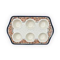 A picture of a Polish Pottery Zaklady Muffin Pan (Orange Wreath) | Y1778-DU52 as shown at PolishPotteryOutlet.com/products/muffin-pan-du52-y1778-du52