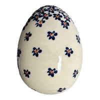 A picture of a Polish Pottery Zaklady 4.5 " Painted Egg (Falling Blue Daisies) | Y1807O2-A882A as shown at PolishPotteryOutlet.com/products/4-5-painted-egg-falling-blue-daisies-y1807o2-a882a