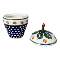A picture of a Polish Pottery Zaklady Strawberry Canister (Persimmon Dot) | Y1873-D479 as shown at PolishPotteryOutlet.com/products/berry-keeper-peacock-peaches-cream-y1873-d479