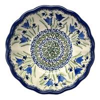 A picture of a Polish Pottery Zaklady 7" Blossom Bowl (Blue Tulips) | Y1946A-ART160 as shown at PolishPotteryOutlet.com/products/wavy-7-bowl-blue-tulips-y1946a-art160