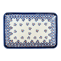A picture of a Polish Pottery Zaklady Small Sushi Tray (Falling Blue Daisies) | Y2021-A882A as shown at PolishPotteryOutlet.com/products/5-x-7-25-small-sushi-tray-falling-blue-daisies-y2021-a882a