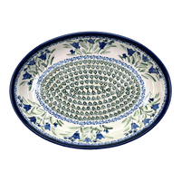 A picture of a Polish Pottery Zaklady 12.25" Oval Baker (Blue Tulips) | Y350A-ART160 as shown at PolishPotteryOutlet.com/products/12-25-oval-baker-blue-tulips-y350a-art160