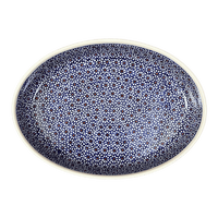 A picture of a Polish Pottery Zaklady 12.25" Oval Baker (Ditsy Daisies) | Y350A-D120 as shown at PolishPotteryOutlet.com/products/12-25-oval-baker-daisy-dot-y350a-d120
