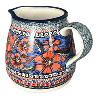 A picture of a Polish Pottery Zaklady 1.2L Pitcher (Exotic Reds) | Y463-ART150 as shown at PolishPotteryOutlet.com/products/1-2-liter-pitcher-exotic-reds-y463-art150