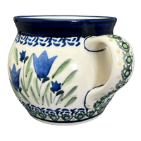 A picture of a Polish Pottery Zaklady 16 oz. Large Belly Mug (Blue Tulips) | Y910-ART160 as shown at PolishPotteryOutlet.com/products/zaklady-16-oz-belly-mug-blue-tulips-y910-art160