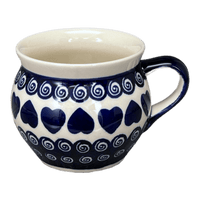 A picture of a Polish Pottery Zaklady 16 oz. Large Belly Mug (Swirling Hearts) | Y910-D467 as shown at PolishPotteryOutlet.com/products/16-oz-large-belly-mug-swirling-hearts-y910-d467