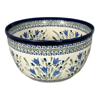 A picture of a Polish Pottery Zaklady Extra- Deep 10.5" Bowl (Blue Tulips) | Y986A-ART160 as shown at PolishPotteryOutlet.com/products/zaklady-10-5-bowl-blue-tulips-y986a-art160