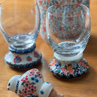A picture of a Polish Pottery 12 oz. Glass (Teal Pompons) | NDA329-62 as shown at PolishPotteryOutlet.com/products/12-oz-glass-teal-pompons-nda329-62