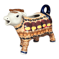 A picture of a Polish Pottery Cow Creamer (Desert Sunrise) | D081U-KLJ as shown at PolishPotteryOutlet.com/products/cow-creamer-desert-sunrise-d081u-klj