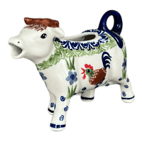 A picture of a Polish Pottery Cow Creamer (Chicken Dance) | D081U-P320 as shown at PolishPotteryOutlet.com/products/4-oz-cow-creamer-chicken-dance-d081u-p320