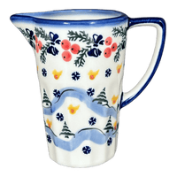 A picture of a Polish Pottery Pitcher, 14 oz, WR (WR7K) in "Bows in Snow" by W.R. Ceramika | WR7K-WR15 as shown at PolishPotteryOutlet.com/products/14-oz-pitcher-bows-in-snow-wr7k-wr15