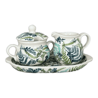 A picture of a Polish Pottery Cream & Sugar Set in "Scattered Ferns" by Manufaktura | K091S-GZ39 as shown at PolishPotteryOutlet.com/products/cream-and-sugar-set-scattered-ferns-k091s-gz39