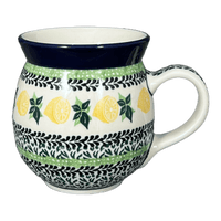 A picture of a Polish Pottery Mug, Belly Mug, 16 oz in "Lemons and Leaves" by Ceramika Artystyczna | A073-2749X as shown at PolishPotteryOutlet.com/products/c-a-16-oz-belly-mug-lemons-and-leaves-a073-2749x