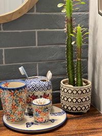A picture of a Polish Pottery Toothbrush Holder (Brilliant Garden) | P213S-DPLW as shown at PolishPotteryOutlet.com/products/toothbrush-holder-brilliant-garden-p213s-dplw