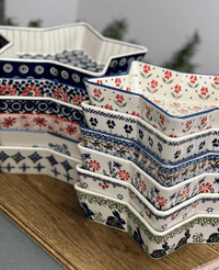 A picture of a Polish Pottery Star-Shaped Bowl/Baker (Brilliant Garden) | M045S-DPLW as shown at PolishPotteryOutlet.com/products/star-shaped-bowl-brilliant-garden-m045s-dplw