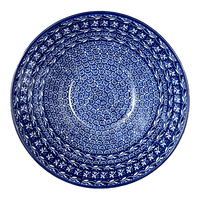 A picture of a Polish Pottery CA 9" Kitchen Bowl (Wavy Blues) | A056-905X as shown at PolishPotteryOutlet.com/products/9-bowl-wavy-blues-a056-905x