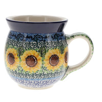 A picture of a Polish Pottery C.A. 16 oz. Belly Mug (Sunflowers) | A073-U4739 as shown at PolishPotteryOutlet.com/products/large-belly-mug-sunflowers