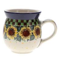 A picture of a Polish Pottery CA 16 oz. Belly Mug (Checkered Sunflowers) | A073-U4740 as shown at PolishPotteryOutlet.com/products/large-belly-mug-checkered-sunflowers