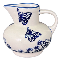 A picture of a Polish Pottery Big Belly Creamer (Butterfly Garden) | D008T-MOT1 as shown at PolishPotteryOutlet.com/products/big-belly-creamer-butterfly-garden-d008t-mot1