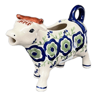 A picture of a Polish Pottery Cow Creamer (Green Tea Garden) | D081T-14 as shown at PolishPotteryOutlet.com/products/cow-creamer-green-tea-garden-d081t-14