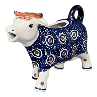 A picture of a Polish Pottery Cow Creamer (Bonbons) | D081T-2 as shown at PolishPotteryOutlet.com/products/cow-creamer-2-d081t-2