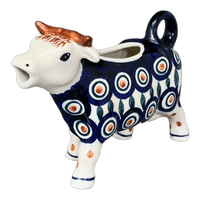 A picture of a Polish Pottery Cow Creamer (Peacock) | D081T-54 as shown at PolishPotteryOutlet.com/products/cow-creamer-peacock-d081t-54
