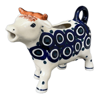 A picture of a Polish Pottery Cow Creamer (Eyes Wide Open) | D081T-58 as shown at PolishPotteryOutlet.com/products/cow-creamer-eyes-wide-open-d081t-58