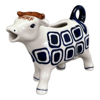 A picture of a Polish Pottery Cow Creamer (Navy Retro) | D081U-601A as shown at PolishPotteryOutlet.com/products/cow-creamer-navy-retro-d081u-601a