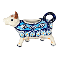 A picture of a Polish Pottery Cow Creamer (Blue Diamond) | D081U-DHR as shown at PolishPotteryOutlet.com/products/cow-creamer-blue-diamond-d081u-dhr