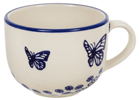 A picture of a Polish Pottery Cup, Latte, 18 oz in "Butterfly Garden" by Manufaktura | F044T-MOT1 as shown at PolishPotteryOutlet.com/products/large-latte-soup-cups-butterfly-garden