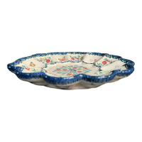 A picture of a Polish Pottery 9" Egg Plate (Butterfly Spring) | GT12-UD1 as shown at PolishPotteryOutlet.com/products/9-egg-plate-ud1-gt12-ud1