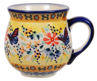 A picture of a Polish Pottery Small Belly Mug (Butterfly Bliss) | K067S-WK73 as shown at PolishPotteryOutlet.com/products/small-belly-mug-butterfly-bliss