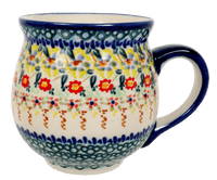 A picture of a Polish Pottery Large Belly Mug (Sunny Border) | K068S-JZ41 as shown at PolishPotteryOutlet.com/products/large-belly-mug-sunny-border