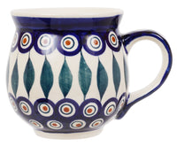 A picture of a Polish Pottery Large Belly Mug (Peacock) | K068T-54 as shown at PolishPotteryOutlet.com/products/large-belly-mug-peacock