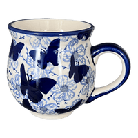 A picture of a Polish Pottery Large Belly Mug (Blue Butterfly) | K068U-AS58 as shown at PolishPotteryOutlet.com/products/large-belly-mug-blue-butterfly-k068u-as58