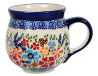 A picture of a Polish Pottery Medium Belly Mug (Festive Flowers) | K090S-IZ16 as shown at PolishPotteryOutlet.com/products/the-medium-belly-mug-festive-flowers