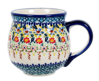 A picture of a Polish Pottery Medium Belly Mug (Sunny Border) | K090S-JZ41 as shown at PolishPotteryOutlet.com/products/the-medium-belly-mug-sunny-border